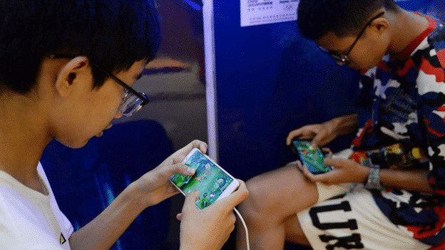 Local gamers playing Honor of Kings by Tencent